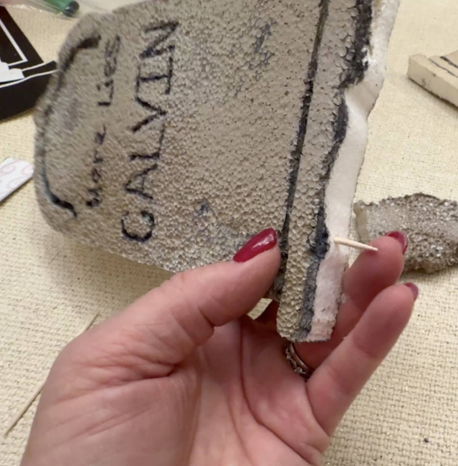 Toothpicks work well to attach the headstone to the base.